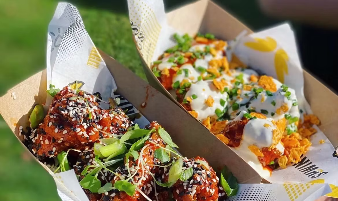 Two Shwings boxes of glazed wings topped with sesame, spring onion and blue-cheese drizzle